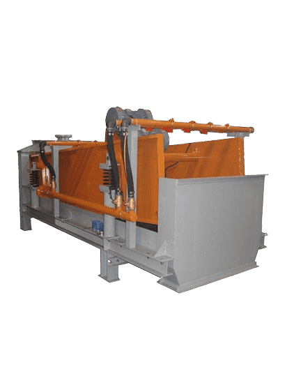 Industrial machinery with an orange and gray structure, featuring hydraulic components and metal framing. The equipment appears designed for material processing or handling in an industrial setting.