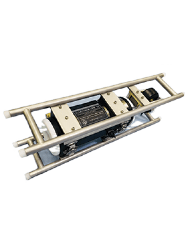 Metallic rectangular frame housing an industrial device with a black central motor and several smaller mechanical components. The frame has cylindrical rods and appears designed for heavy-duty applications or machinery integration. The background is plain white.